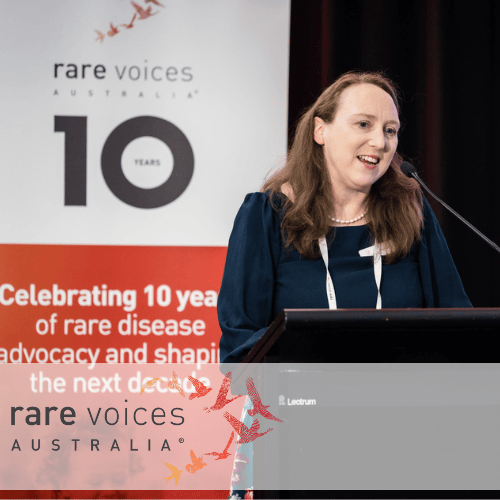 Image of Nicole Millis in front of Rare Voices Australia banner Image of Nicole Millis in front of Rare Voices Australia banner